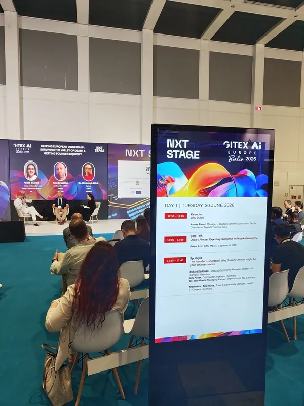 A stage screen showing the live conference agenda at GITEX Europe 2026 at Messe Berlin